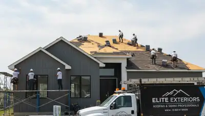 Roof replacement and vinyl siding experts working on Dallas TX home exterior renovation